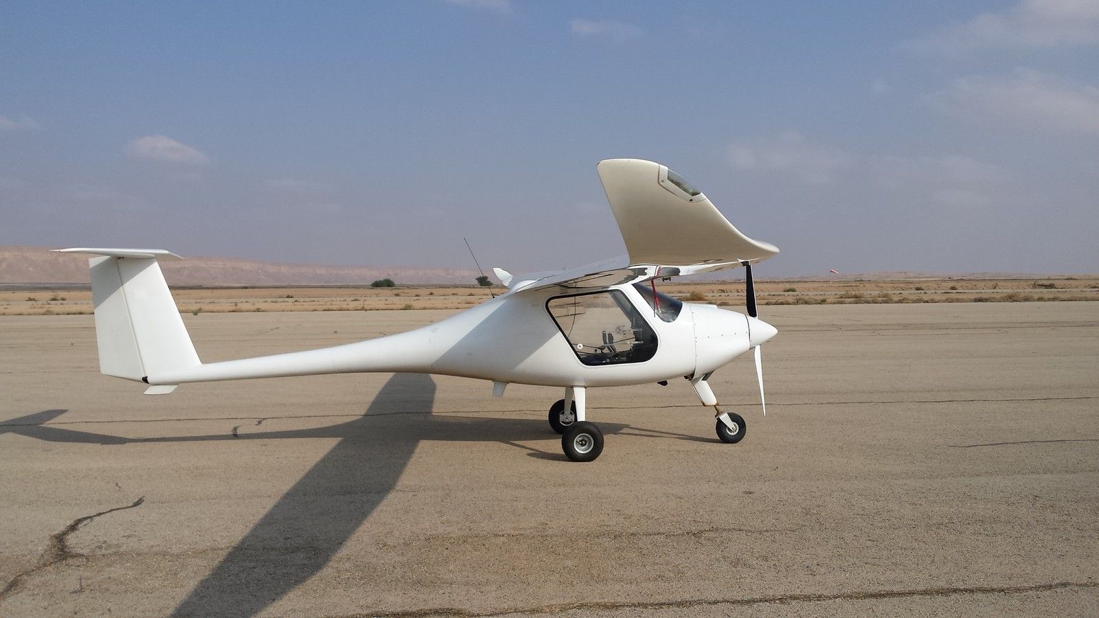 ALBATROSS 2.2 parked on a desert airfield apron