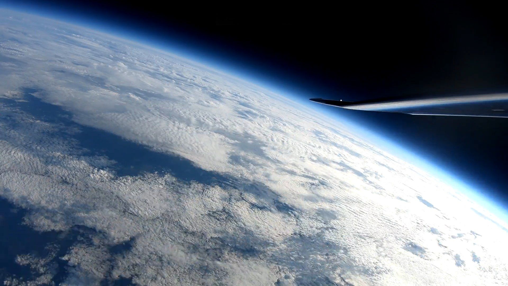 The wing of the HiDRON stratospheric glider above the curvature of the Earth