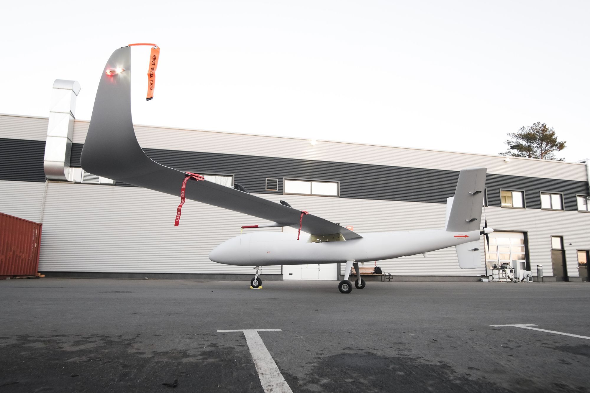 The S1-V300 MALE unmanned aircraft on the apron in front of a hangar